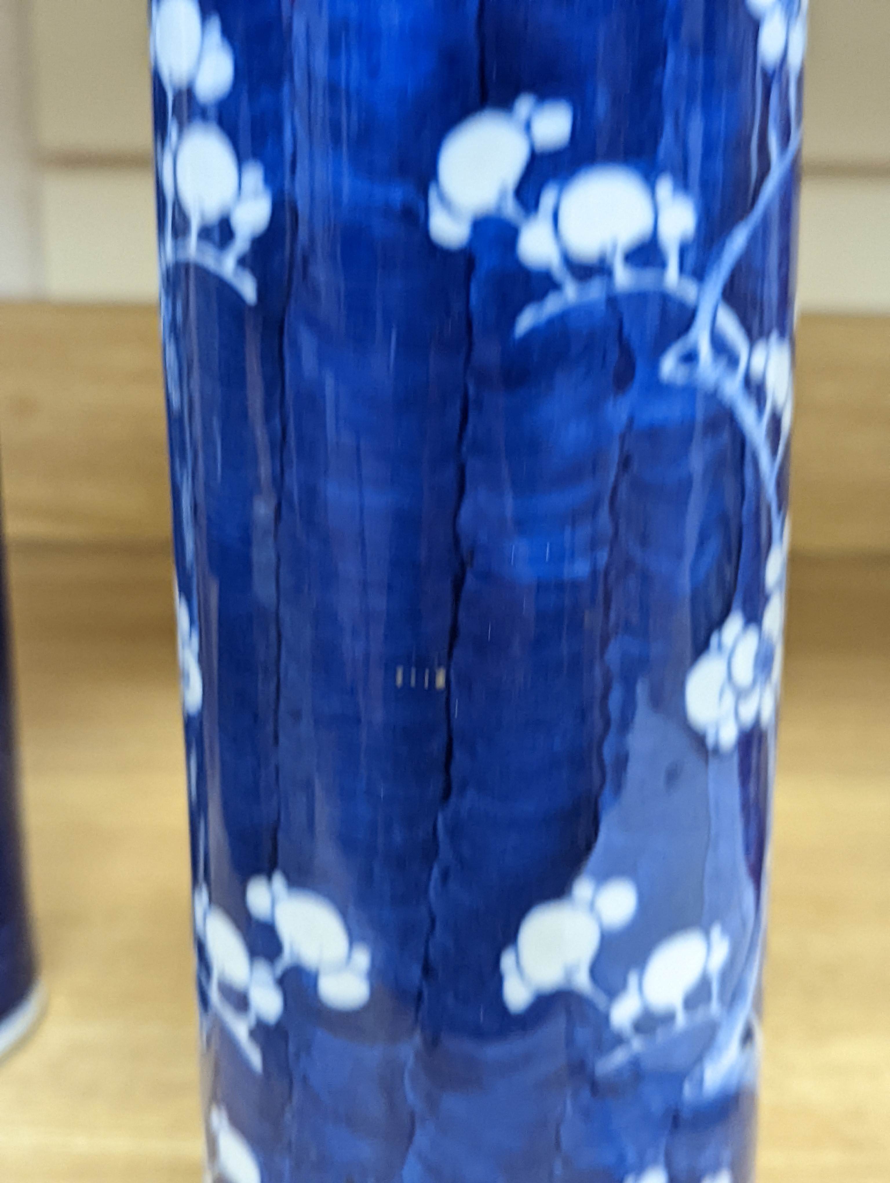 An 18th century Chinese famille rose mug, a Chinese Imari tea caddy and two Chinese blue and white sleeve vases 30cm (4)